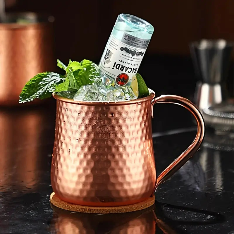 Classic Stainless Moscow Mule Mug With Hammered Copper Exterior Pattern | Oak & Sugar | The Classic Stainless Moscow Mule Mug: Where Luxe Meets Fizz Calling all cocktail connoisseurs and aficionados of extraordinary experiences! Are you ready to elevate y