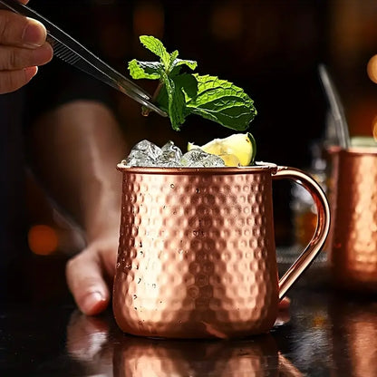 Classic Stainless Moscow Mule Mug With Hammered Copper Exterior Pattern | Oak & Sugar | The Classic Stainless Moscow Mule Mug: Where Luxe Meets Fizz Calling all cocktail connoisseurs and aficionados of extraordinary experiences! Are you ready to elevate y