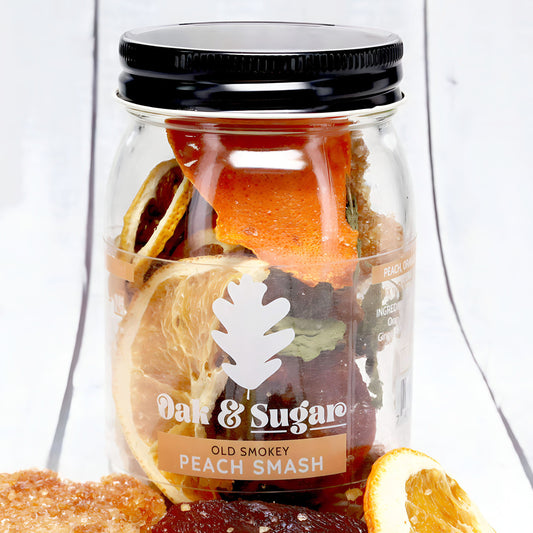 Old Smokey Peach Smash Cocktail Infusion Kit (8 servings) | Oak & Sugar | A fruity, refreshing cocktail with a slightly spicy kick. This peachy delight is the perfect way to start a chilly winter evening around the fire. Or over ice and garnished with fre